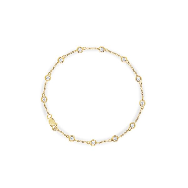 Pulsera oro tipo cadena con 12 diamantes.